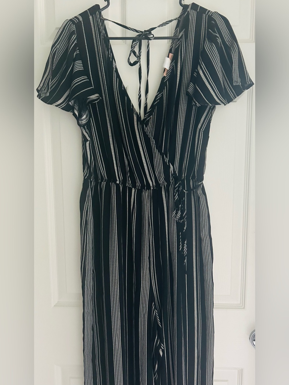 Black and white striped v-neck wide legged Wrap Jumpsuit